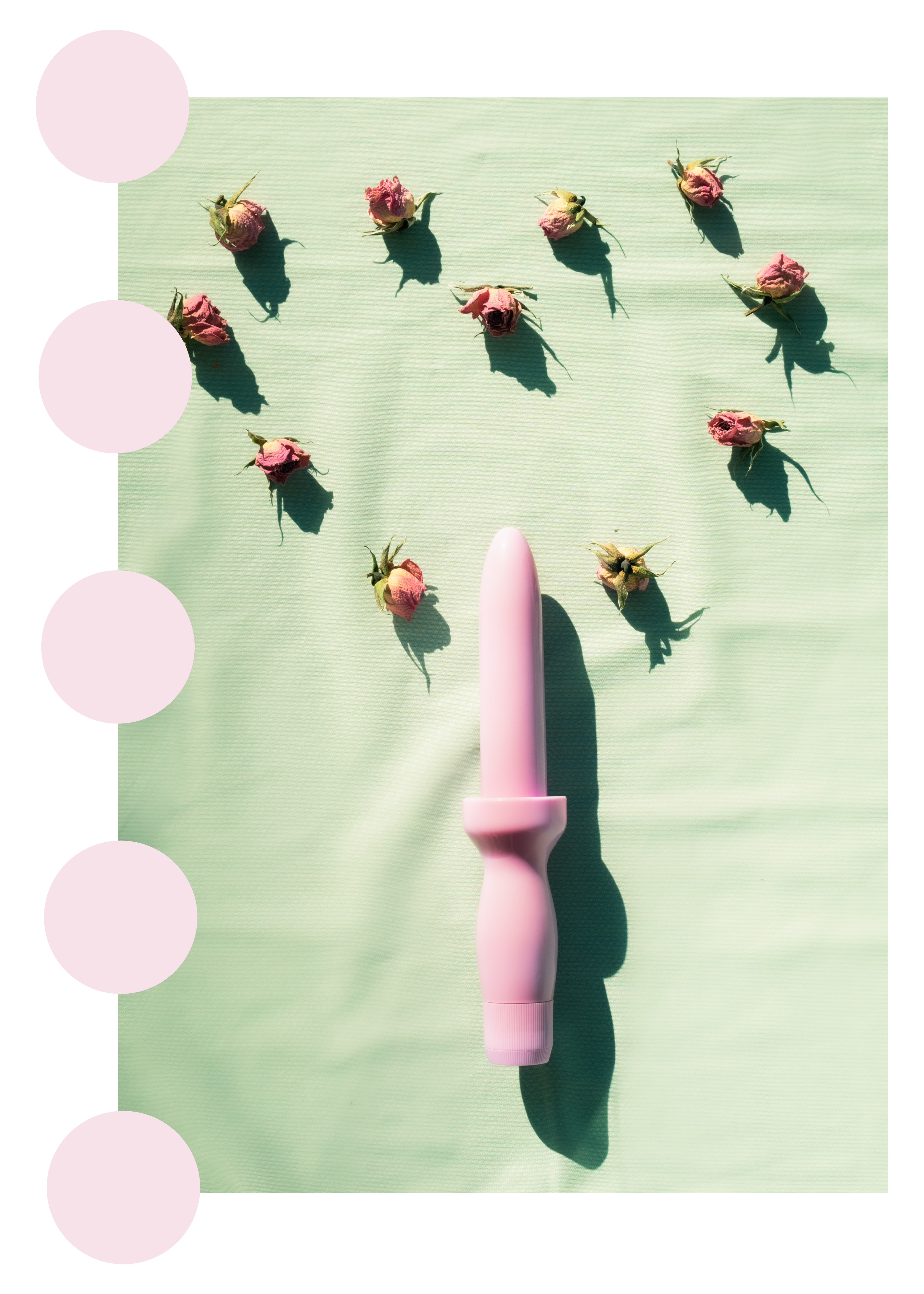 light pink dilator pointing at dried roses positioned in the form of a heart